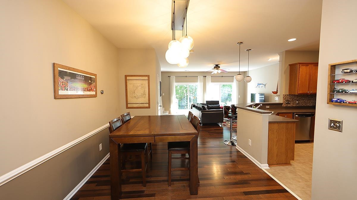 7020 Racine Way Raleigh, NC 27690 - Photo 5 of 26 You will love the sunny, private view out back that greets you as soon as you walk in. Beautiful newer engineered hardwood floors installed on 1st floor 2018. Dining/Living Area
