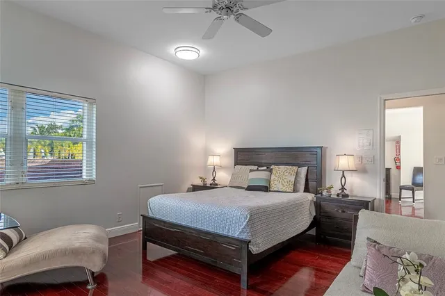 a bedroom with a bed and window