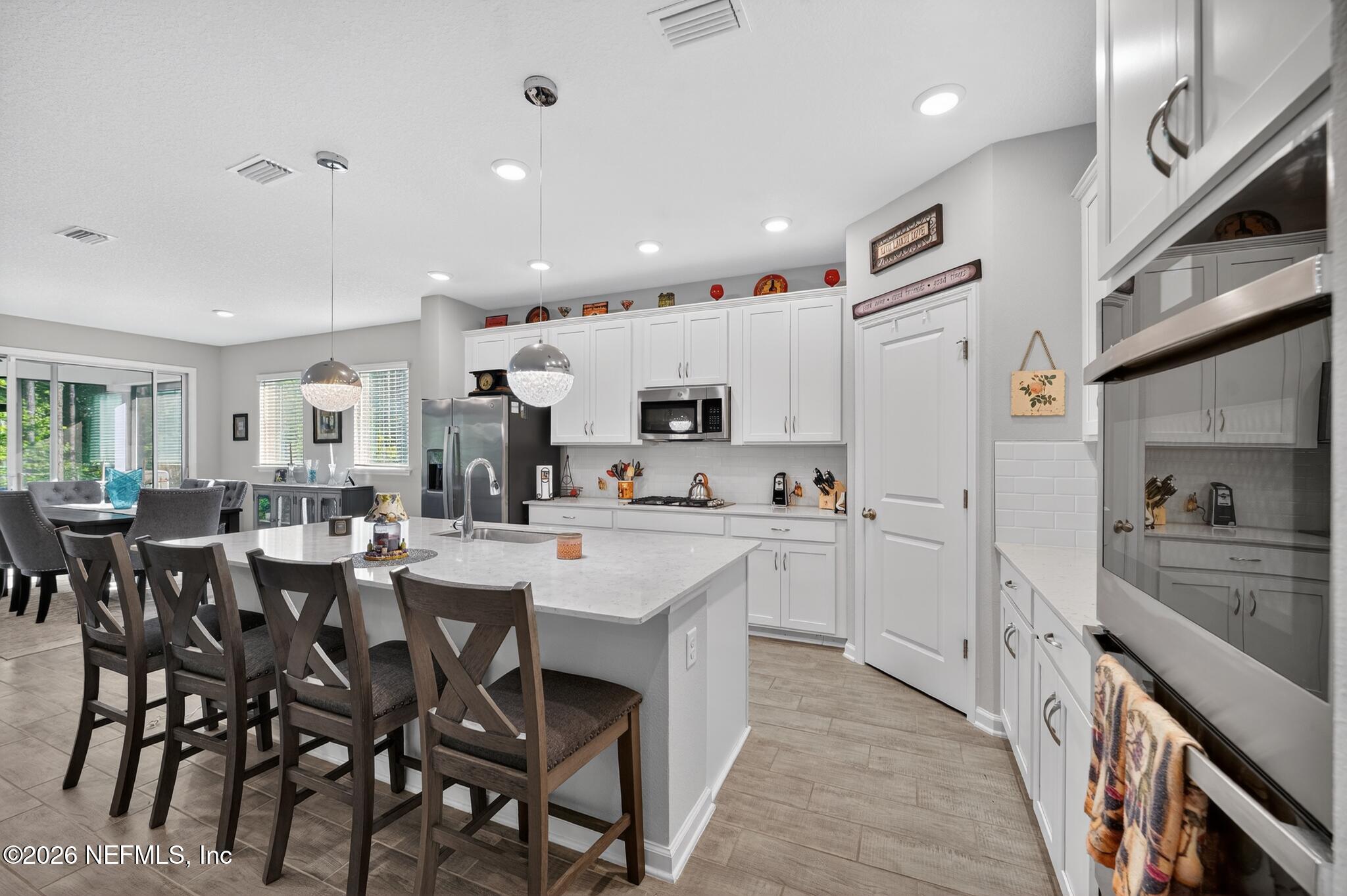75505 Banyan Way Yulee, FL 32097 - Photo 12 of 30 a kitchen with appliances a sink and cabinets