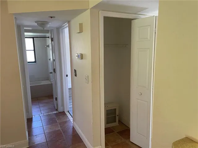 a view of a bathroom with a sink and a mirror
