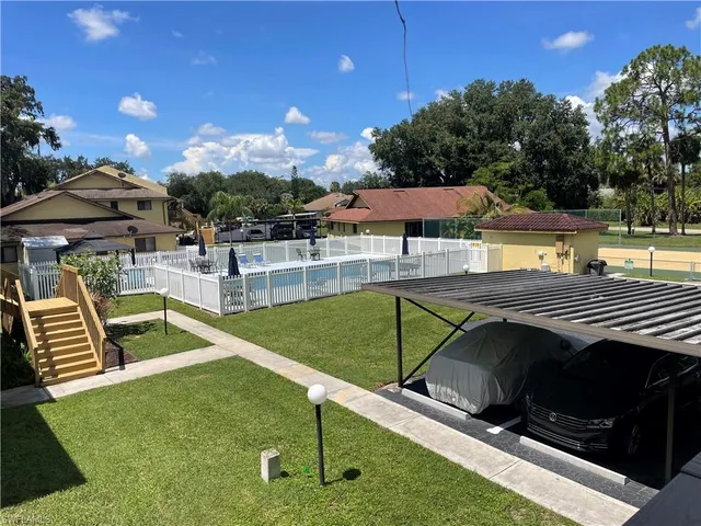 swimming pool view with a seating space
