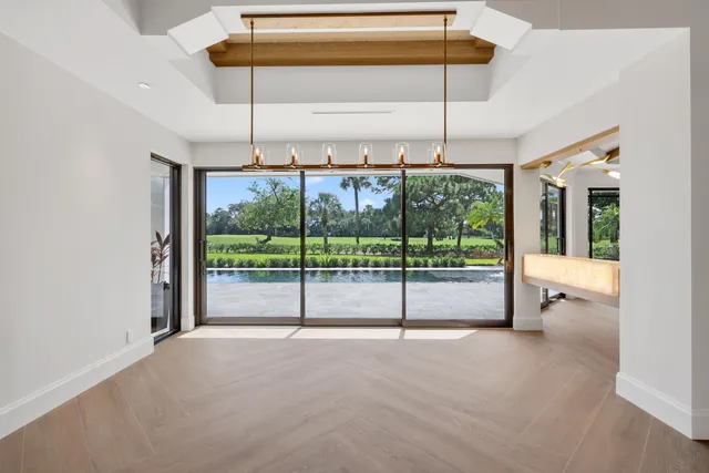 a view of a livingroom with a fireplace and window