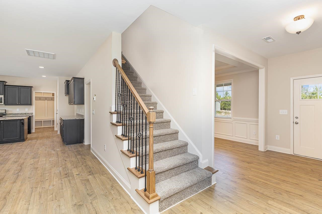 426 Jackson Pond Drive Smithfield, NC 27577 - Photo 19 of 32 a view of entryway and hall with wooden floor