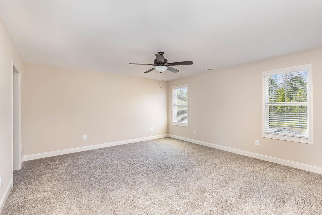 426 Jackson Pond Drive Smithfield, NC 27577 - Photo 26 of 32 a view of a livingroom with a ceiling fan and window
