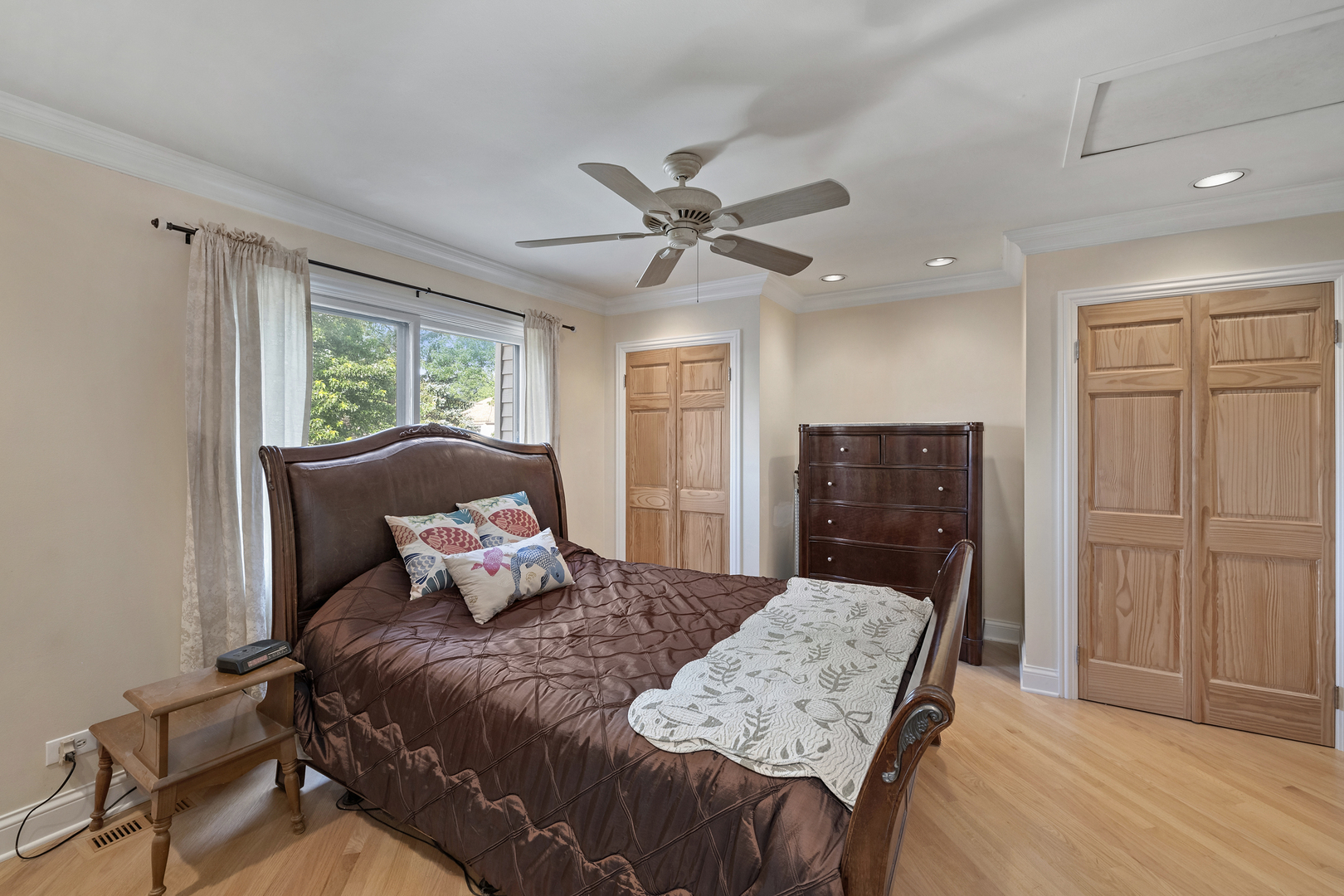 375 Juniper Tree Court Hoffman Estates, IL 60169 - Photo 13 of 24 a bedroom with a bed and wooden floor