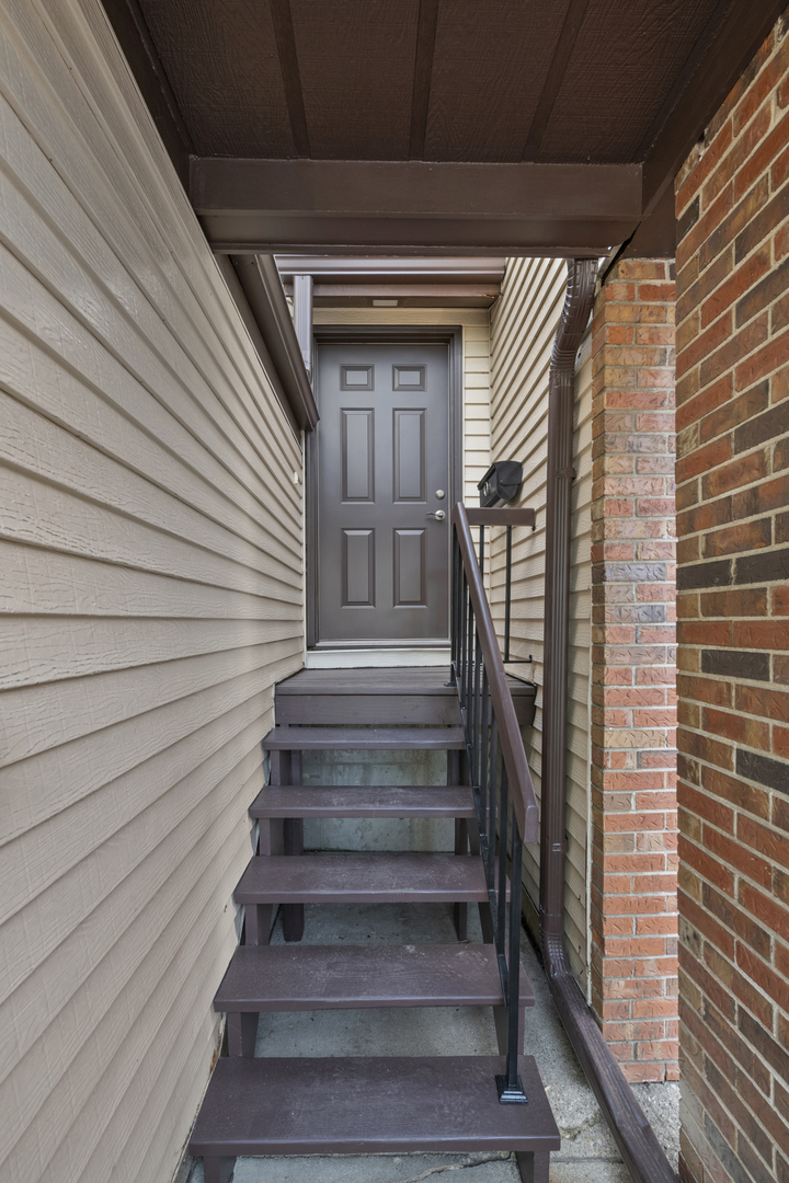375 Juniper Tree Court Hoffman Estates, IL 60169 - Photo 2 of 24 a view of entryway with wooden floor and stairs