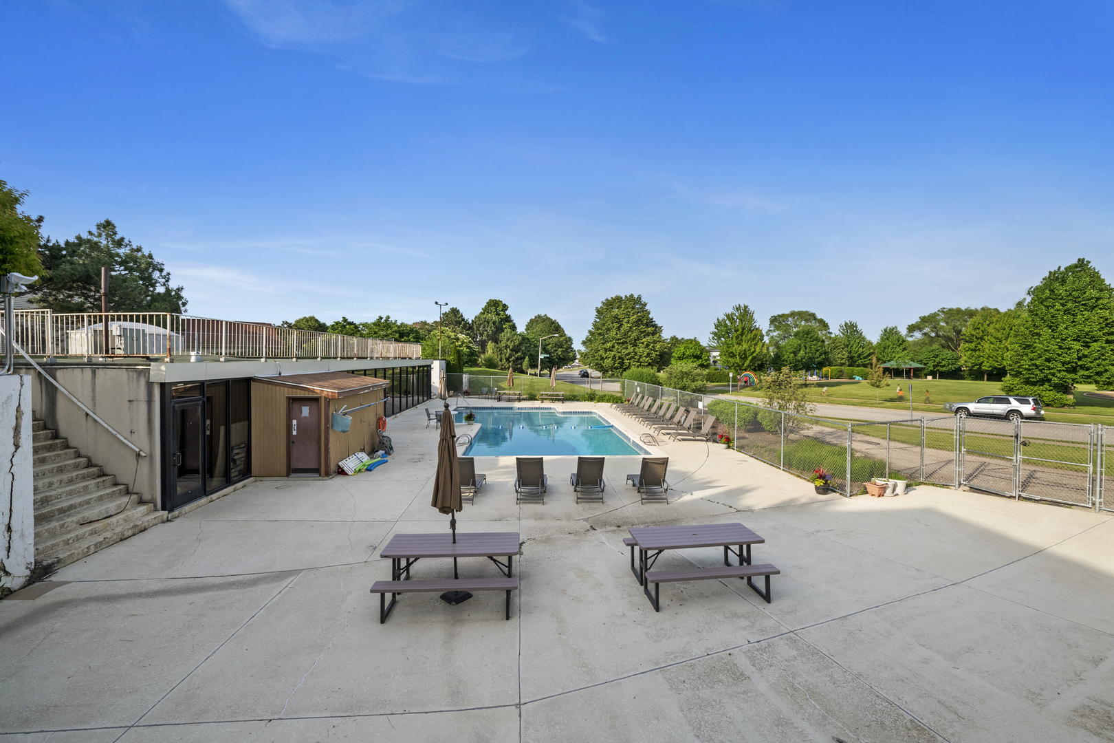 375 Juniper Tree Court Hoffman Estates, IL 60169 - Photo 23 of 24 a swimming pool with outdoor seating and yard