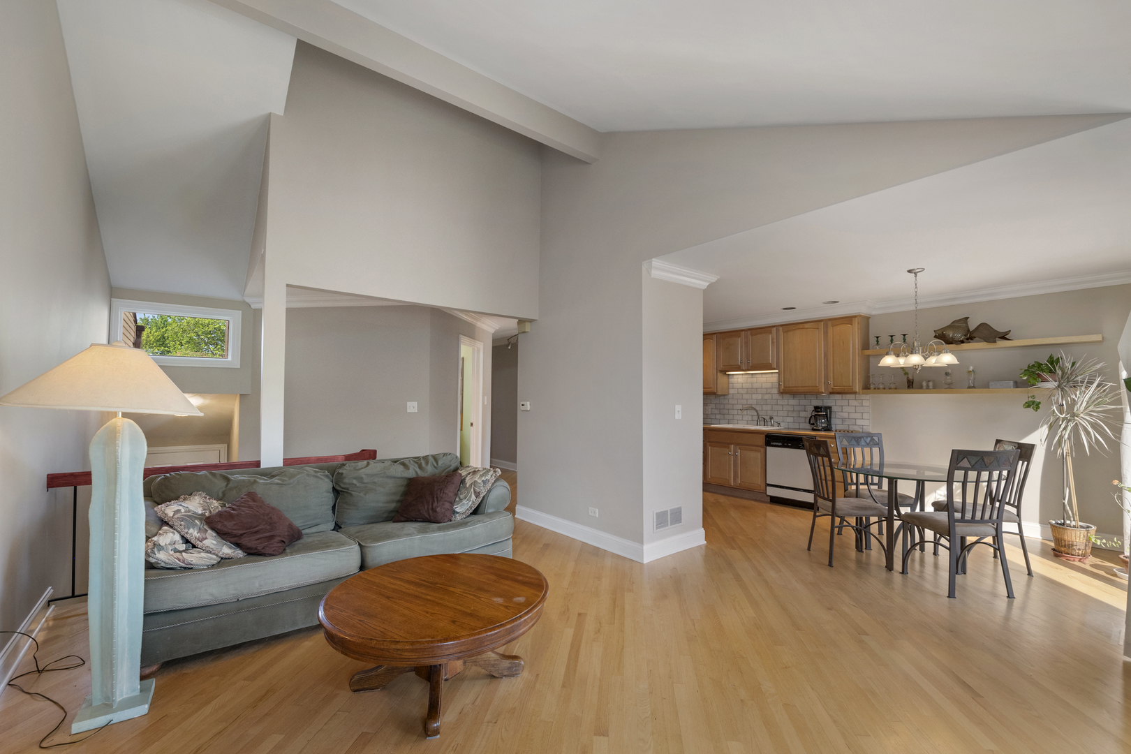 375 Juniper Tree Court Hoffman Estates, IL 60169 - Photo 5 of 24 a living room with furniture and a dining table with kitchen view