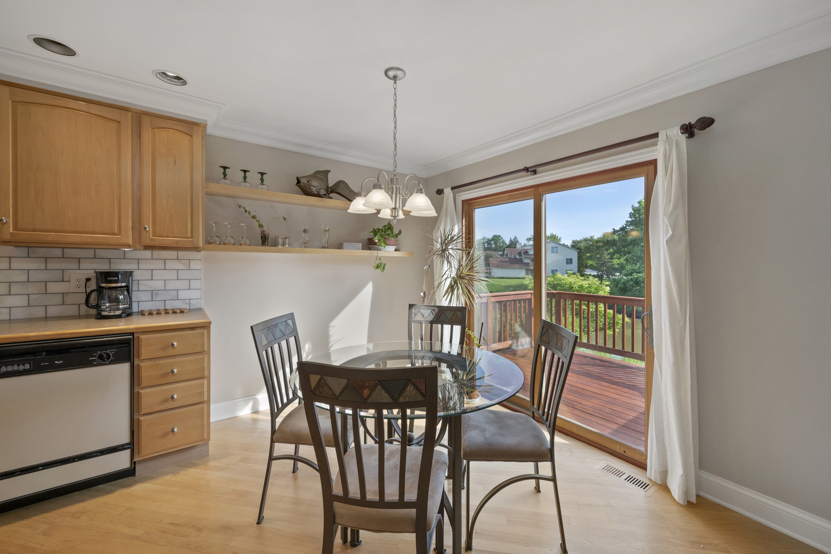 375 Juniper Tree Court Hoffman Estates, IL 60169 - Photo 6 of 24 a view of a dining room with furniture window and outside view