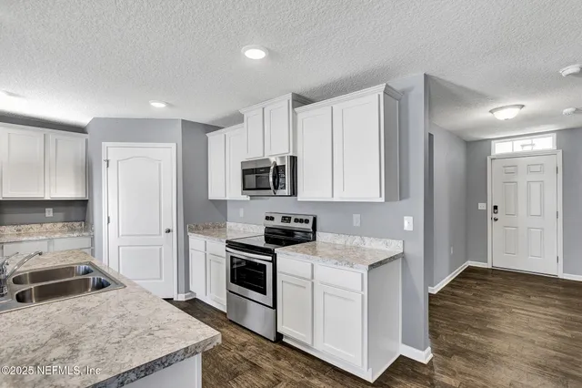 a view of a swimming pool with an outdoor seating