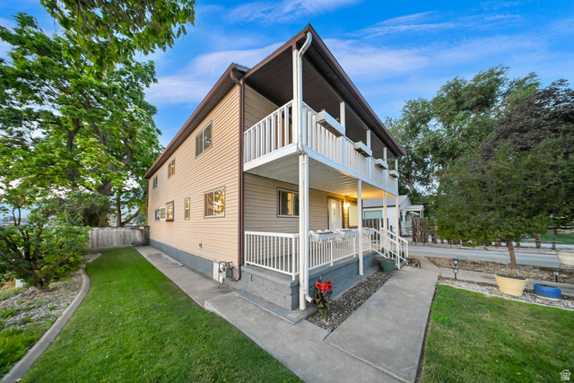 374 West Lakeview Road Lindon, UT 84042 - Photo 2 of 44 Two-story residence featuring light beige siding and white railing accents