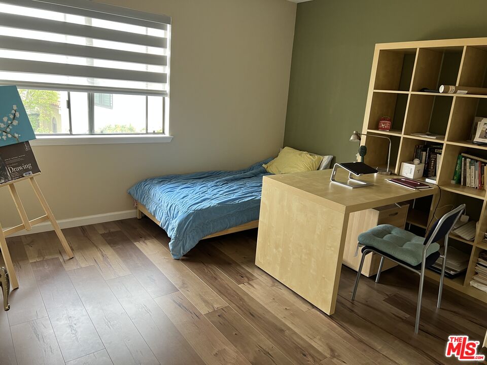 19528 Eagle Ridge Lane Porter Ranch, CA 91326 - Photo 11 of 20 a bedroom with a bed and a window