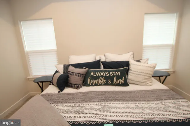 a bedroom with a bed and window