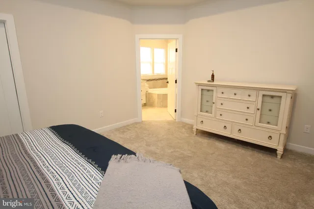 a view of a bedroom with cabinet