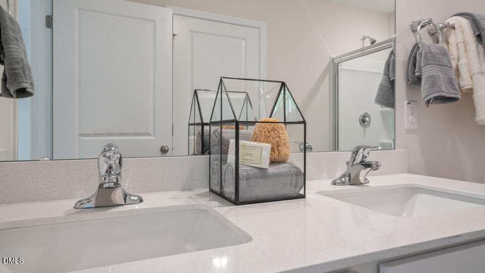 304 Perseus Street Angier, NC 27501 - Photo 25 of 34 a bathroom with a sink and a mirror