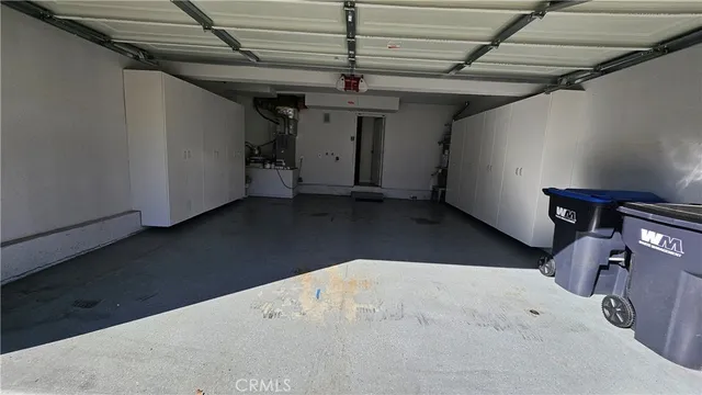 a bedroom with a bed and a potted plant