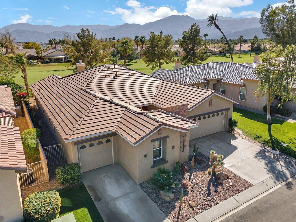 aerial view of a house with a yard