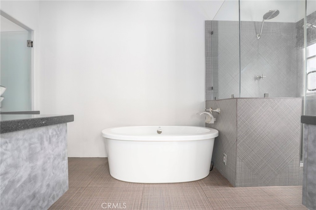 1175 Corte Riviera Camarillo, CA 93010 - Photo 11 of 23 a white bath tub sitting in a bathroom