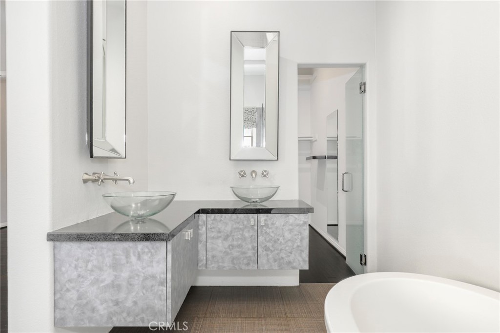 1175 Corte Riviera Camarillo, CA 93010 - Photo 12 of 23 a bathroom with a granite countertop sink a toilet and a mirror