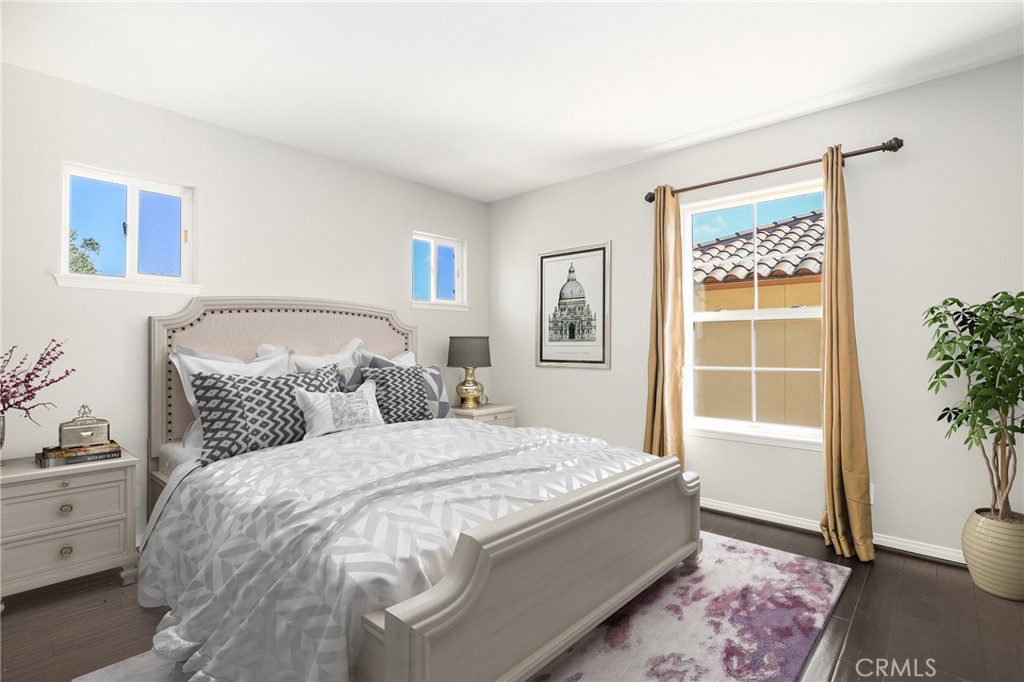 1175 Corte Riviera Camarillo, CA 93010 - Photo 13 of 23 a bedroom with a large bed and a window