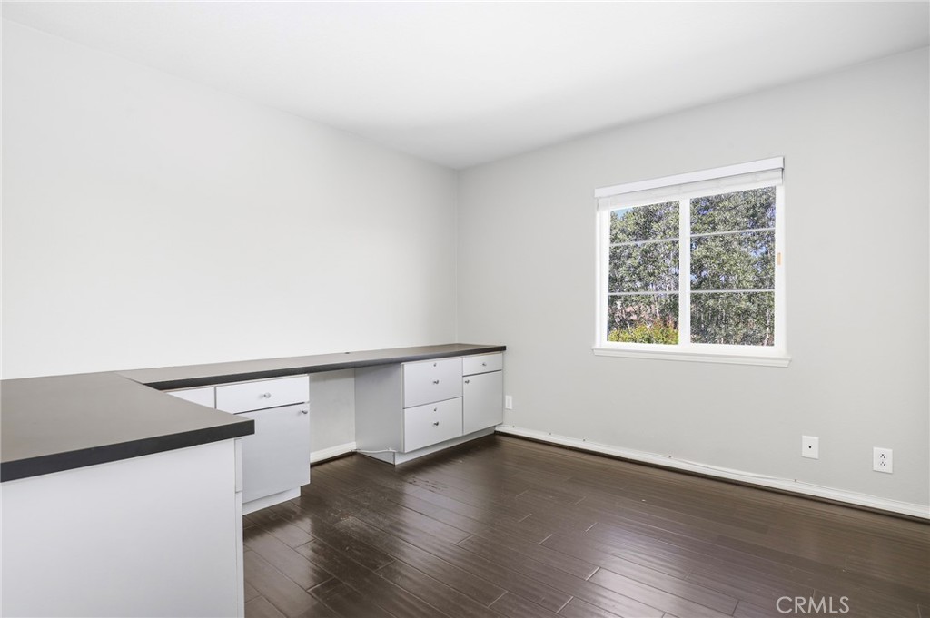 1175 Corte Riviera Camarillo, CA 93010 - Photo 14 of 23 a view of an empty room with wooden floor and a window