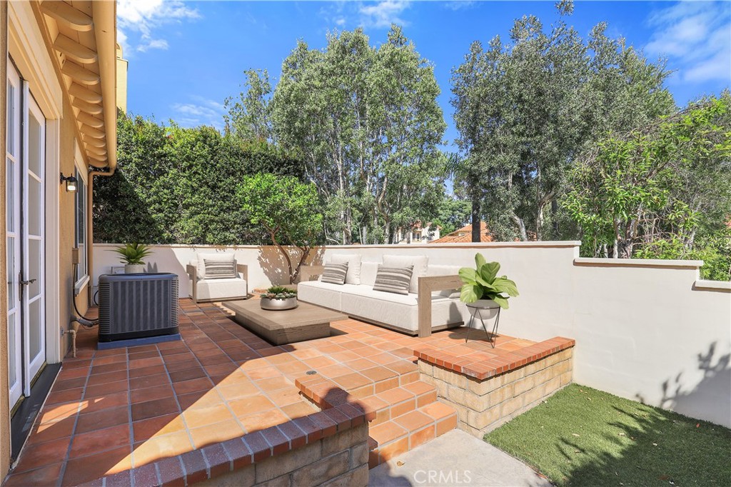 1175 Corte Riviera Camarillo, CA 93010 - Photo 16 of 23 a view of a patio with couches table and chairs and potted plants