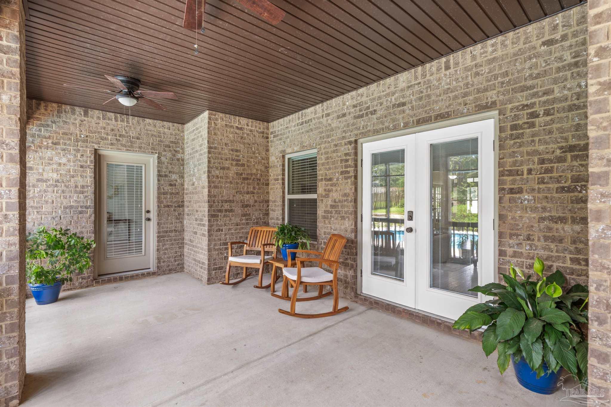 2698 Tulip Hill Road Pace, FL 32571 - Photo 50 of 65 a view of a room with chairs and a potted plant