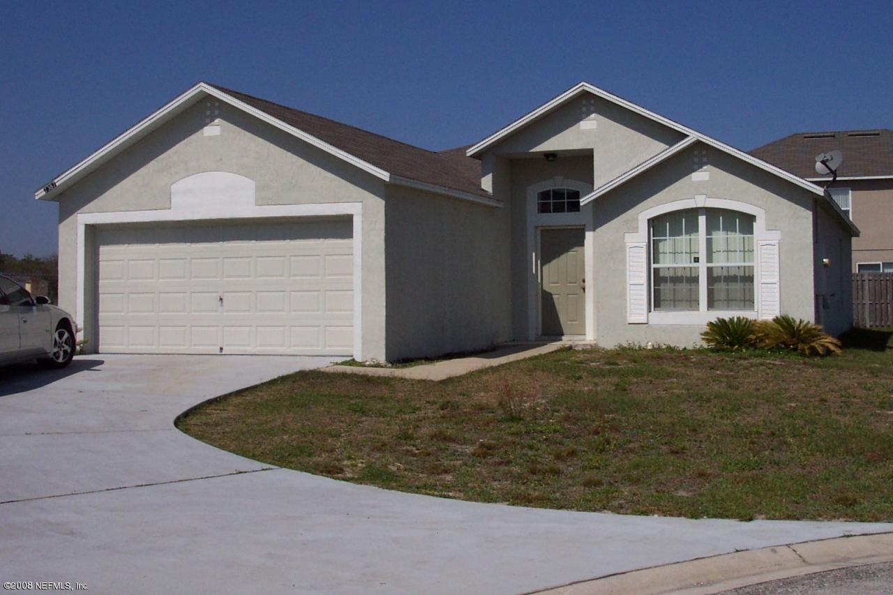7387 Spring Hill Road Jacksonville, FL 32244 - Photo 1 of 15 a front view of a house with a yard