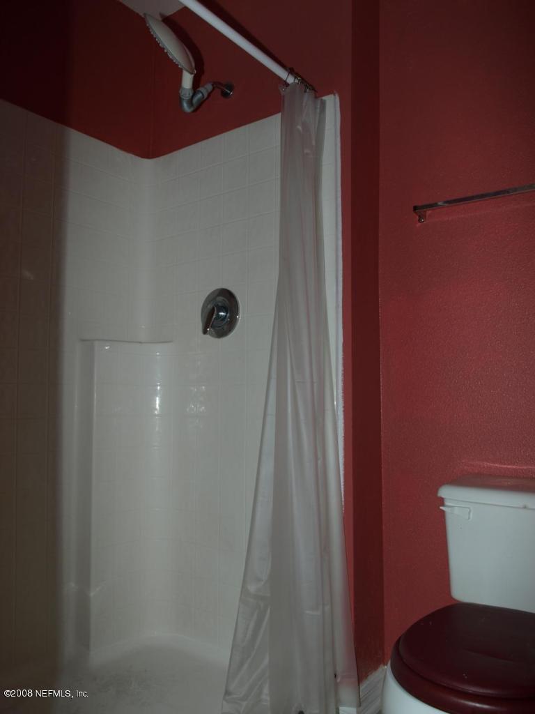 7387 Spring Hill Road Jacksonville, FL 32244 - Photo 12 of 15 a bathroom with a shower