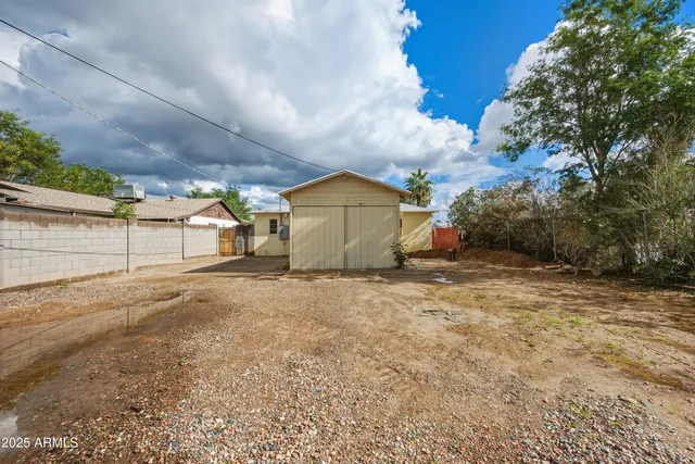 an aerial view of a houses with city view