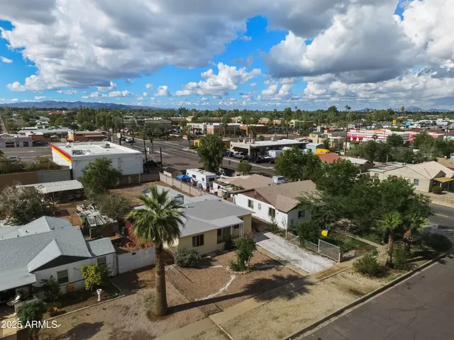 an aerial view of multiple houses with outdoor space