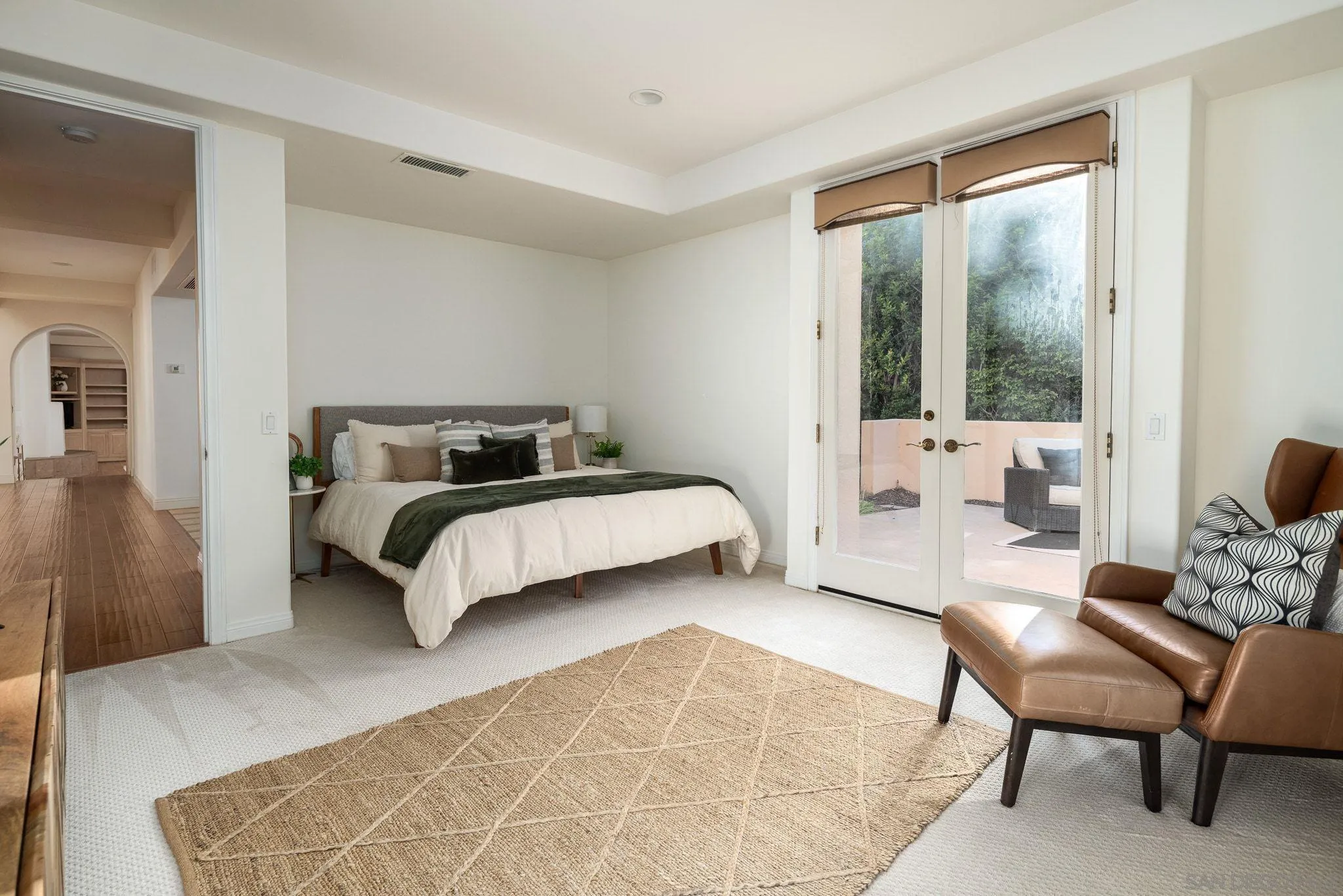 17249 Camino De Montecillo Rancho Santa Fe, CA 92067 - Photo 15 of 21 a bedroom with a bed and glass window