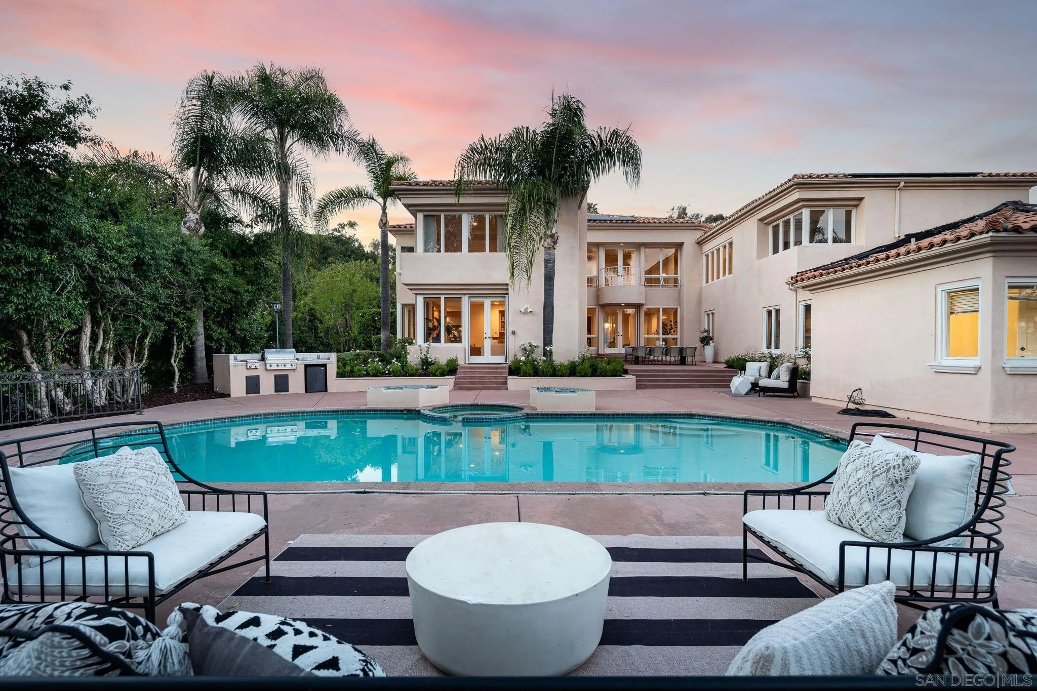 17249 Camino De Montecillo Rancho Santa Fe, CA 92067 - Photo 3 of 21 a view of a house with backyard sitting area and swimming pool