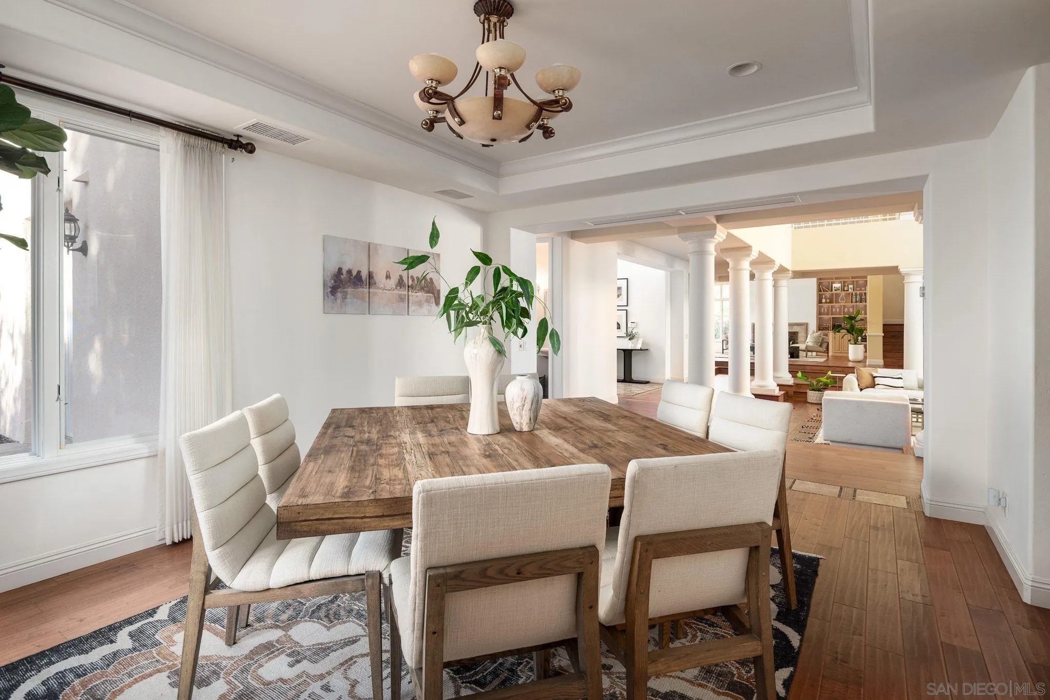 17249 Camino De Montecillo Rancho Santa Fe, CA 92067 - Photo 5 of 21 a view of a dining room with furniture wooden floor and chandelier