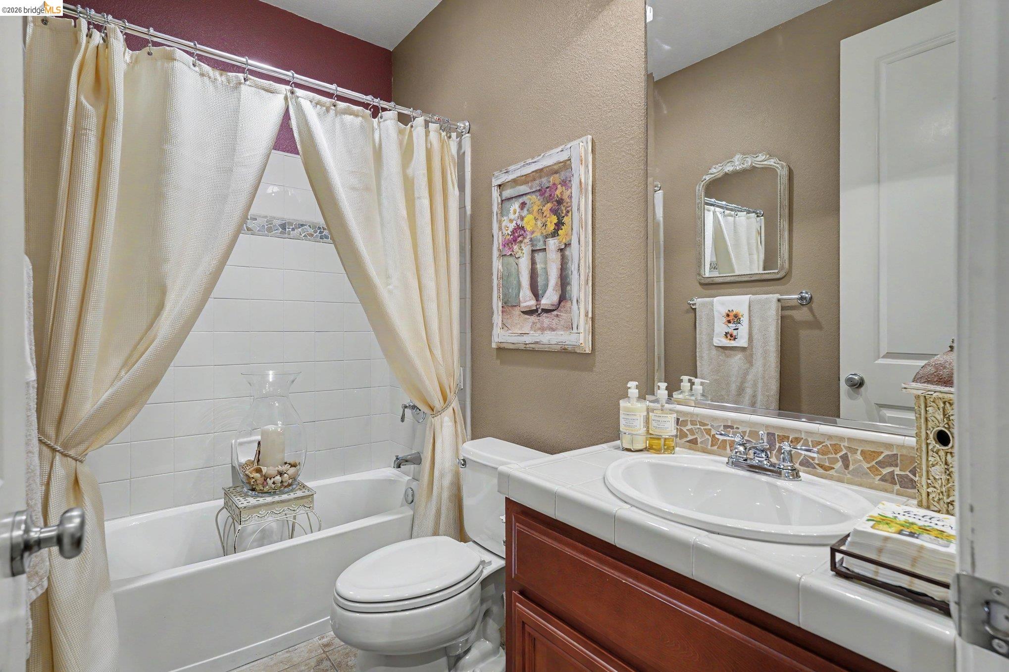 106 Little Ranch Circle Oakley, CA 94561 - Photo 7 of 34 Bathroom featuring a tub/shower combination with white subway tile surround and decorative accent tile