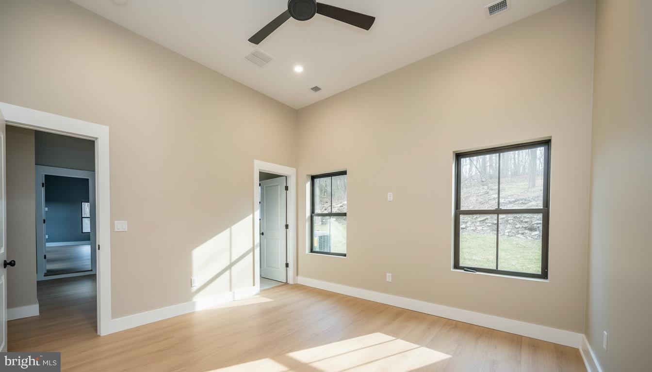 353 Lower Camp Road McHenry, MD 21541 - Photo 28 of 67 a view of an empty room with window and wooden floor
