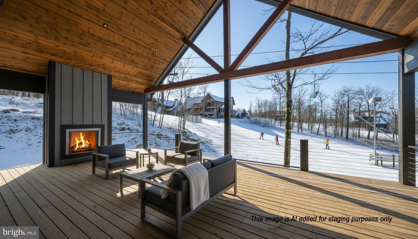 353 Lower Camp Road McHenry, MD 21541 - Photo 30 of 67 a living room with furniture a fireplace and a floor to ceiling window