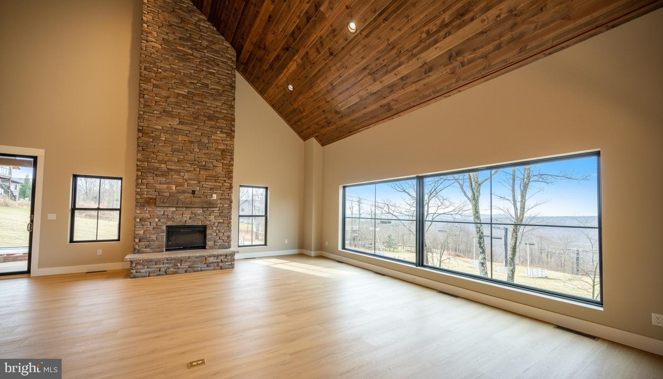 353 Lower Camp Road McHenry, MD 21541 - Photo 3 of 67 a view of an empty room with a fireplace and a window