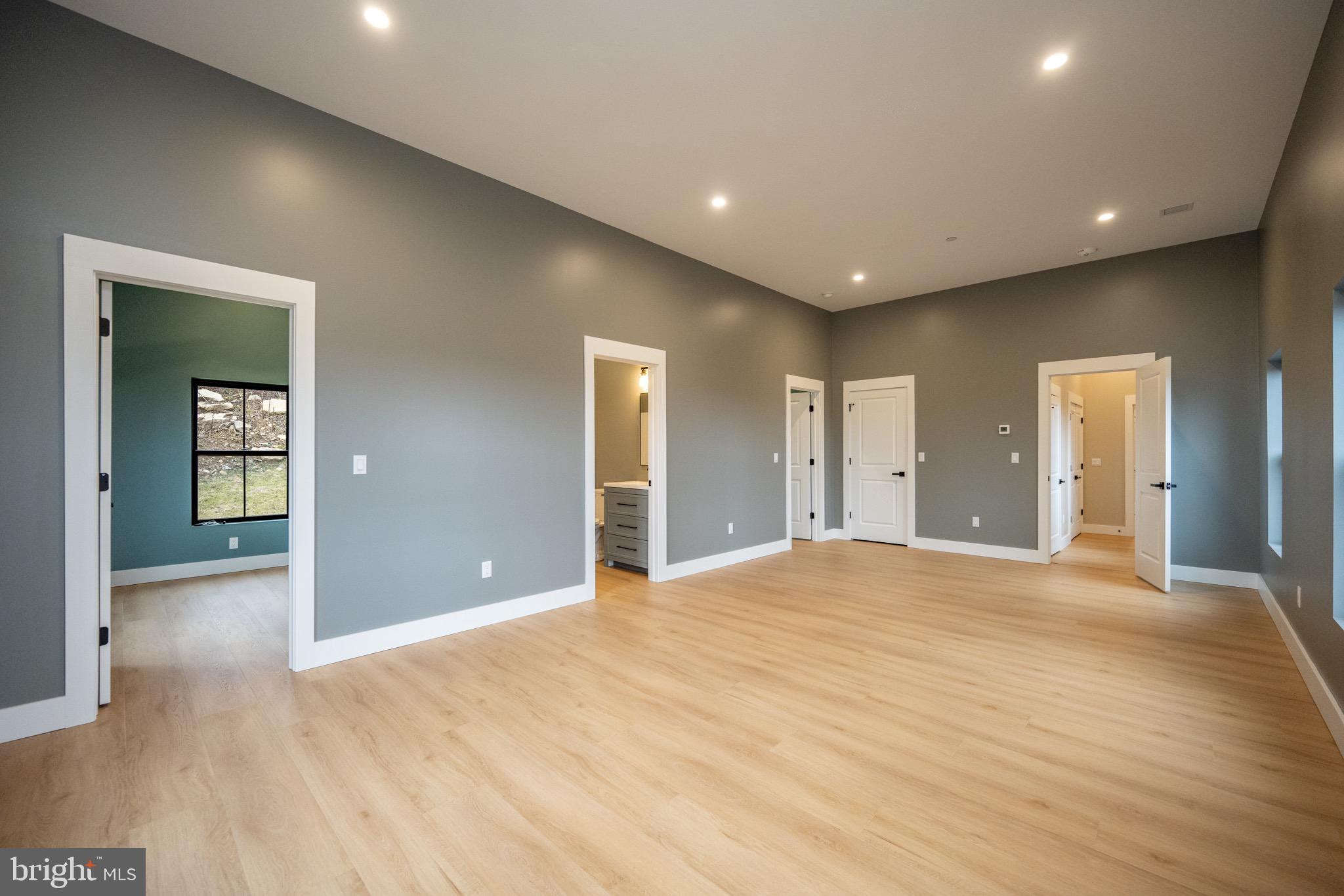 353 Lower Camp Road McHenry, MD 21541 - Photo 31 of 67 a view of an empty room with wooden floor and closet