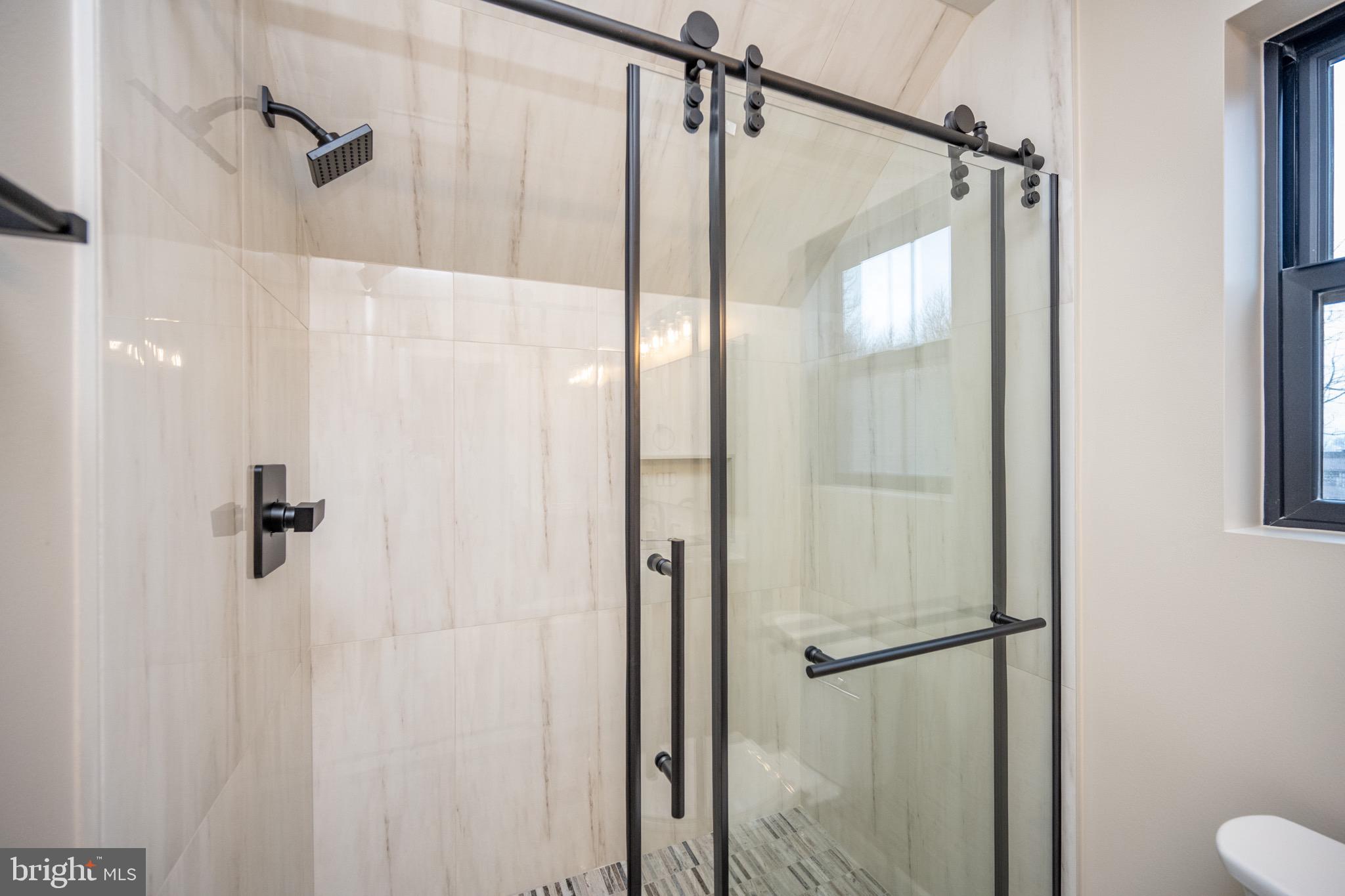 353 Lower Camp Road McHenry, MD 21541 - Photo 37 of 67 a bathroom with a shower and a glass door