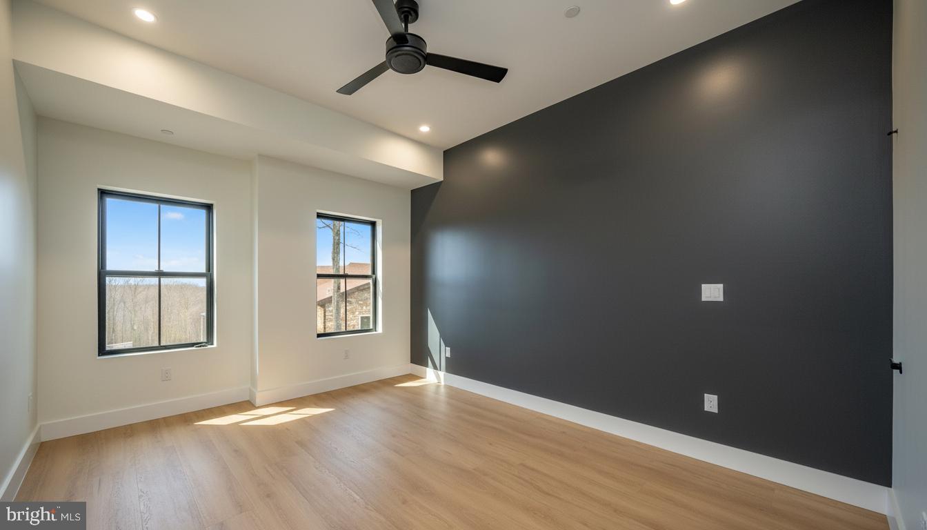 353 Lower Camp Road McHenry, MD 21541 - Photo 40 of 67 an empty room with wooden floor and windows