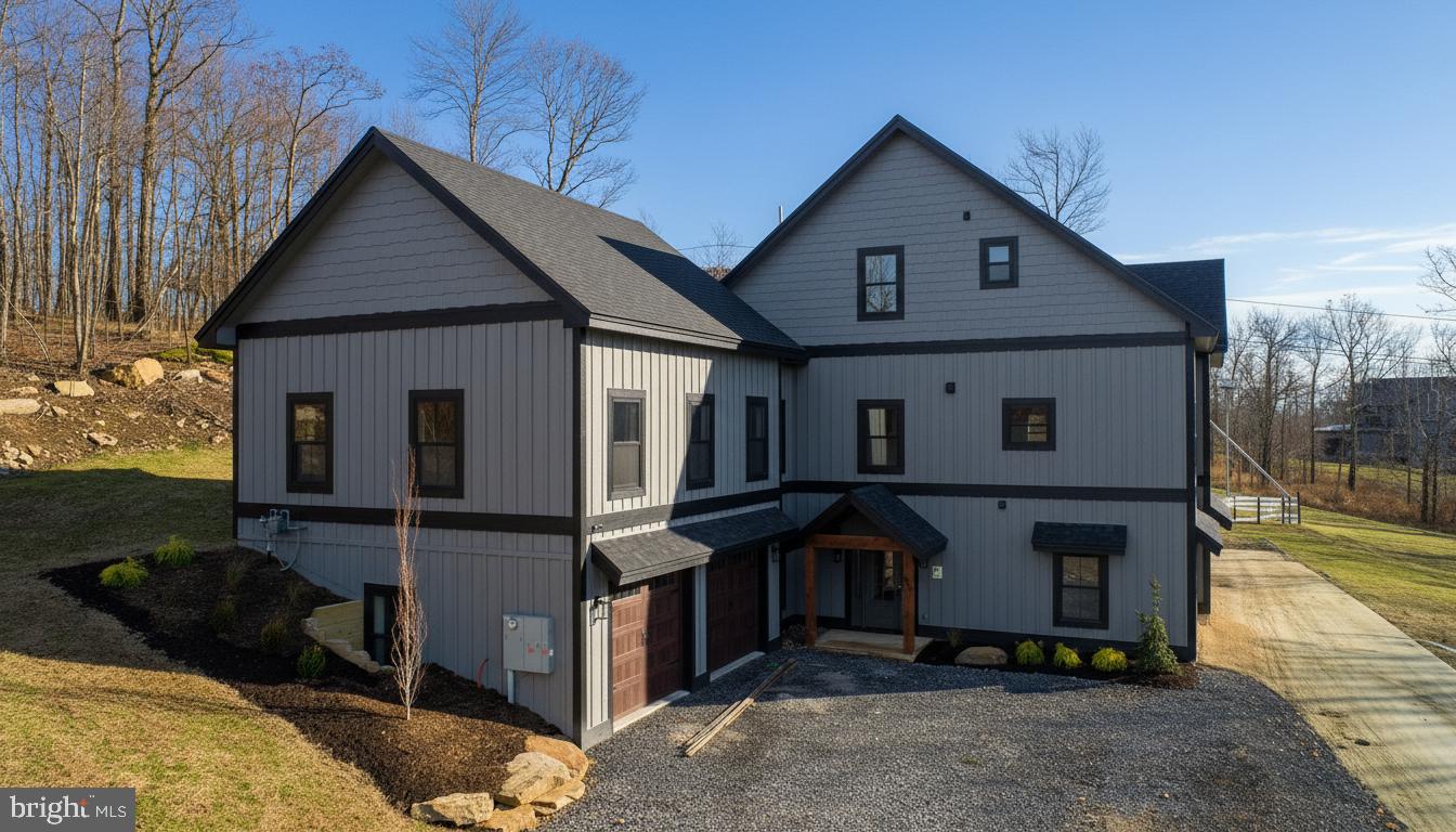 353 Lower Camp Road McHenry, MD 21541 - Photo 46 of 67 a front view of a house with garden