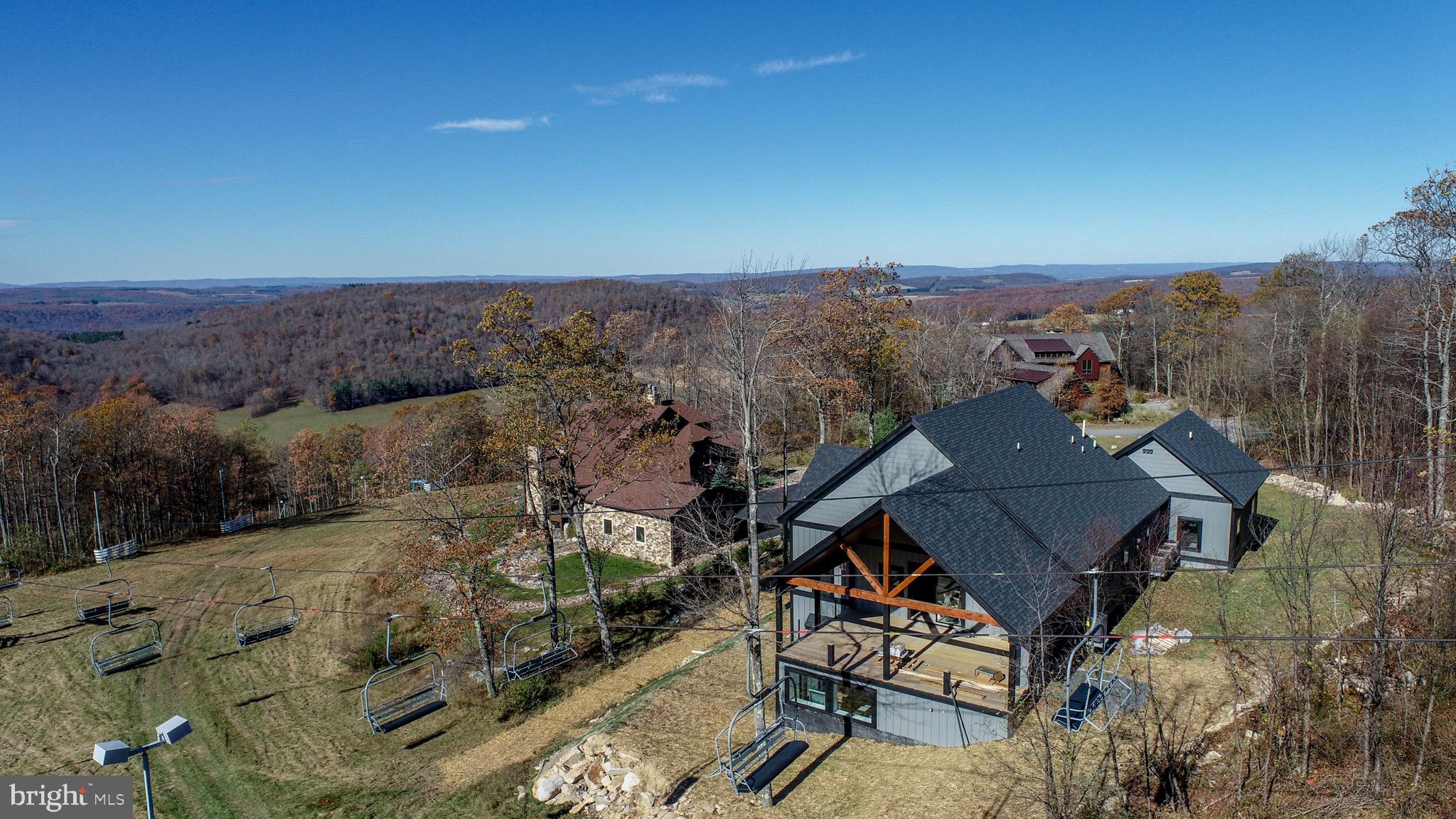 353 Lower Camp Road McHenry, MD 21541 - Photo 47 of 67 an aerial view of a house with a mountain