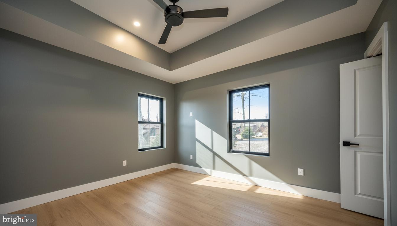 353 Lower Camp Road McHenry, MD 21541 - Photo 50 of 67 a view of an empty room with a window and wooden floor