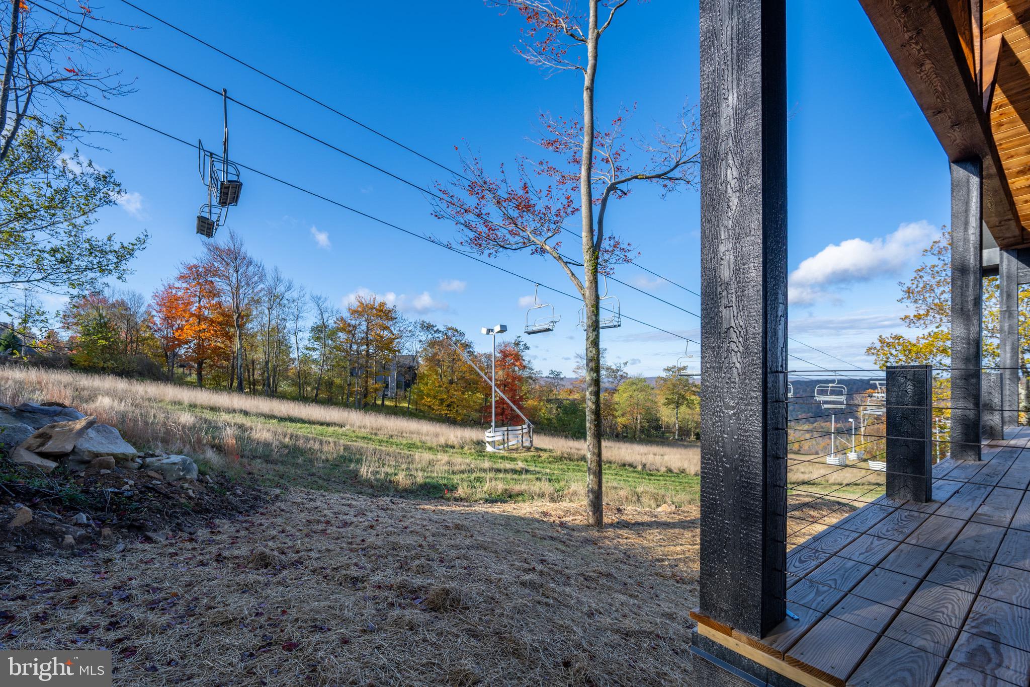 353 Lower Camp Road McHenry, MD 21541 - Photo 56 of 67 a view of a porch with a floor to ceiling window with wooden fence