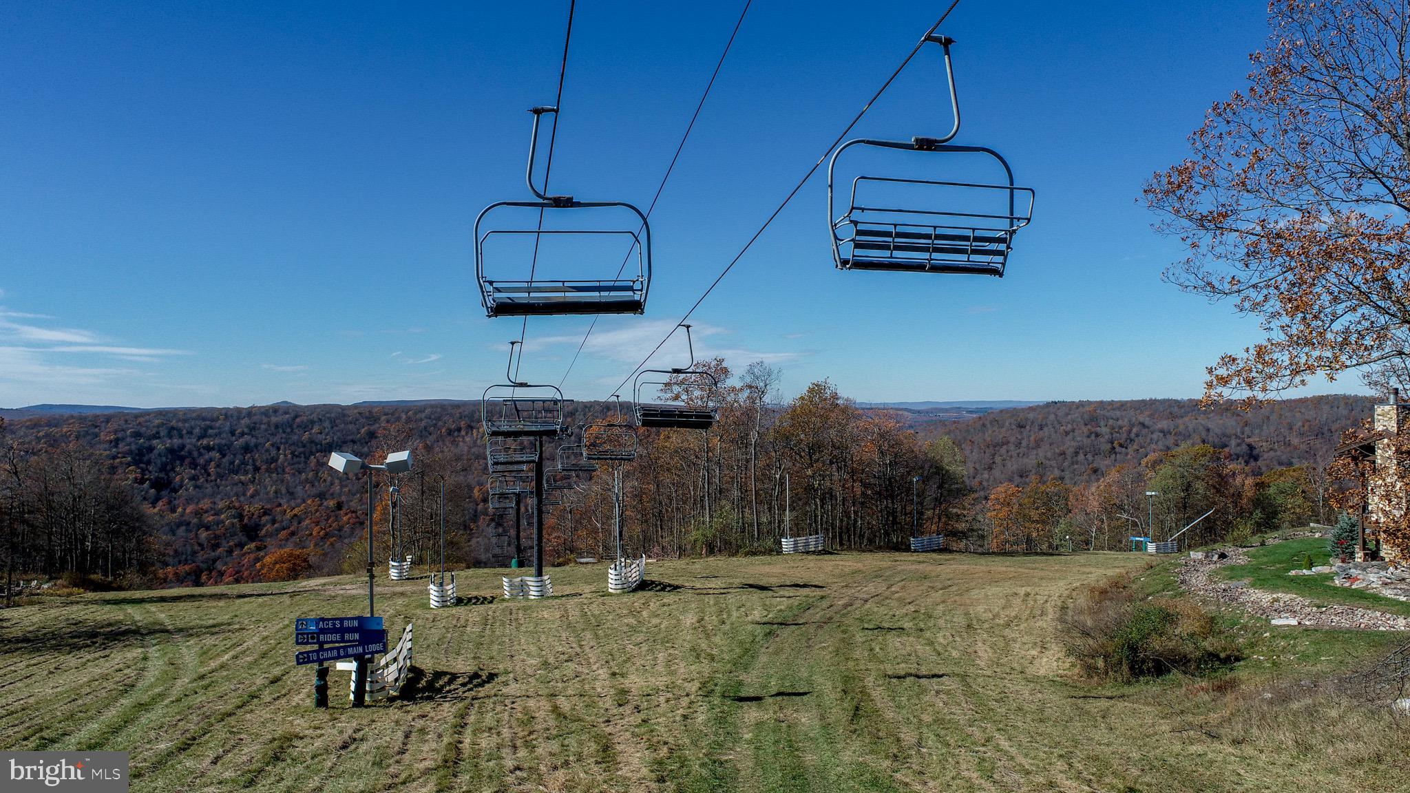 353 Lower Camp Road McHenry, MD 21541 - Photo 58 of 67 a backyard of a house with wooden fence and a yard