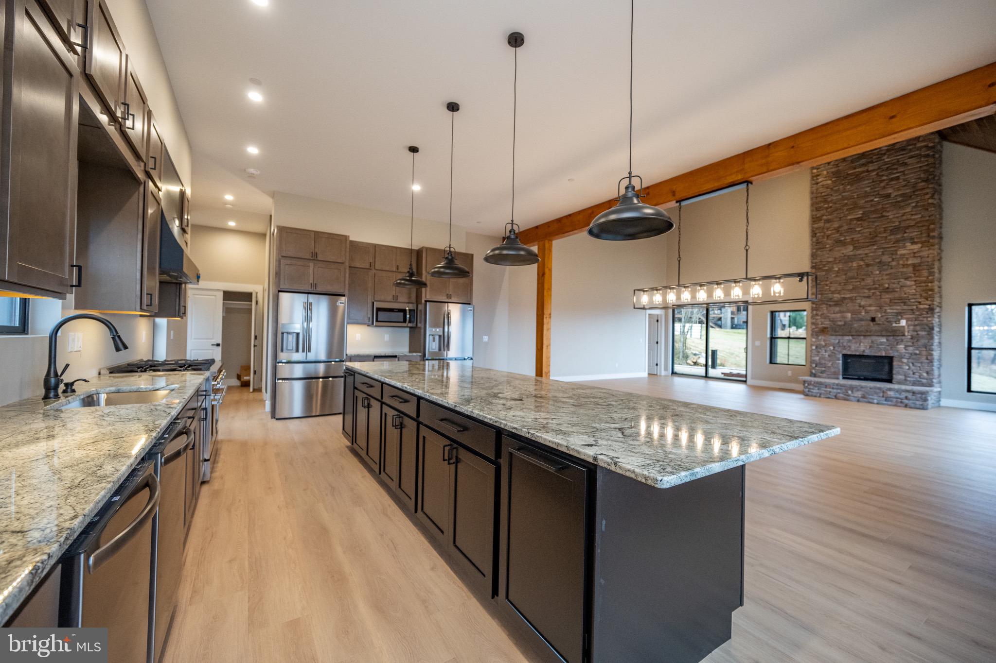 353 Lower Camp Road McHenry, MD 21541 - Photo 6 of 67 a open kitchen with stainless steel appliances granite countertop plenty wooden cabinets