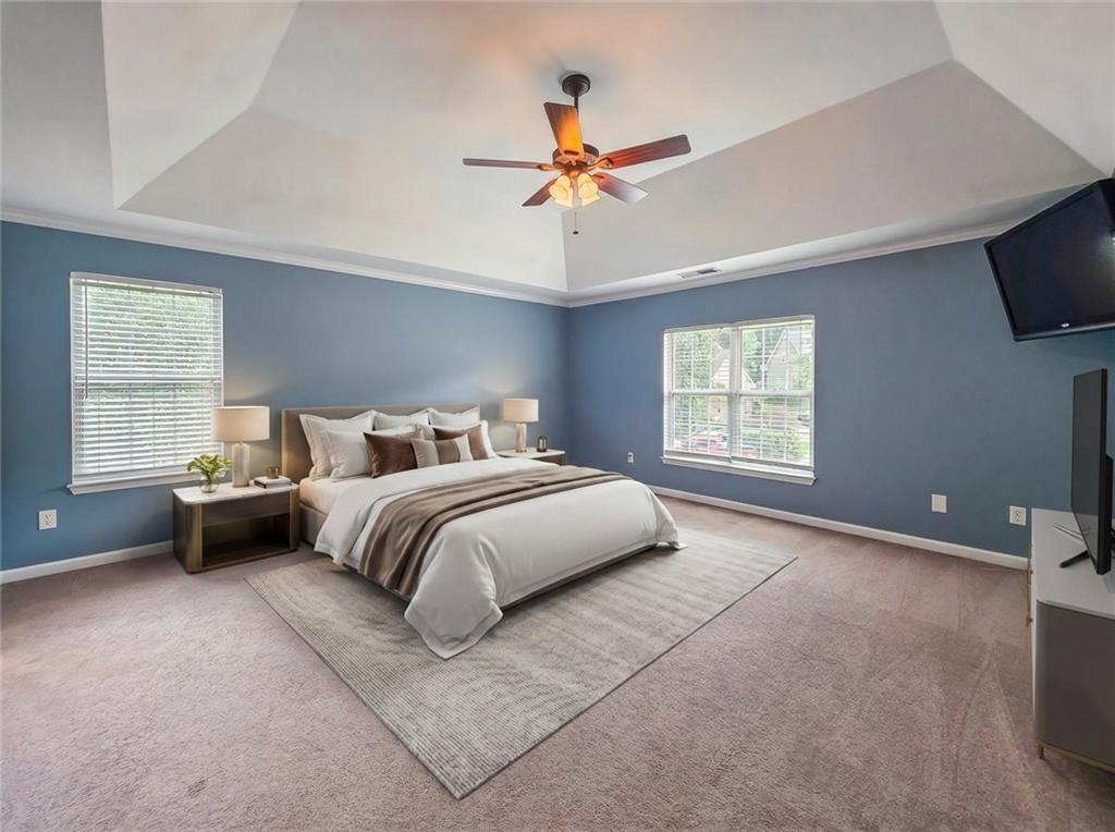 43 Ivy Mist Lane Acworth, GA 30101 - Photo 16 of 58 a bedroom with a bed and a chandelier