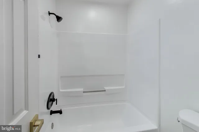 a view of a bathroom with closet area