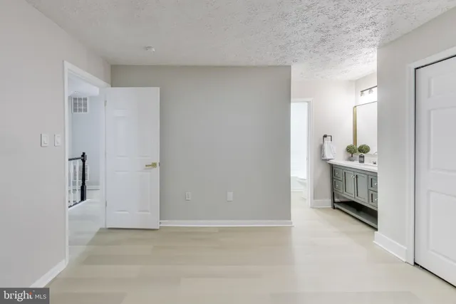 a view of a porch with wooden floor and bench